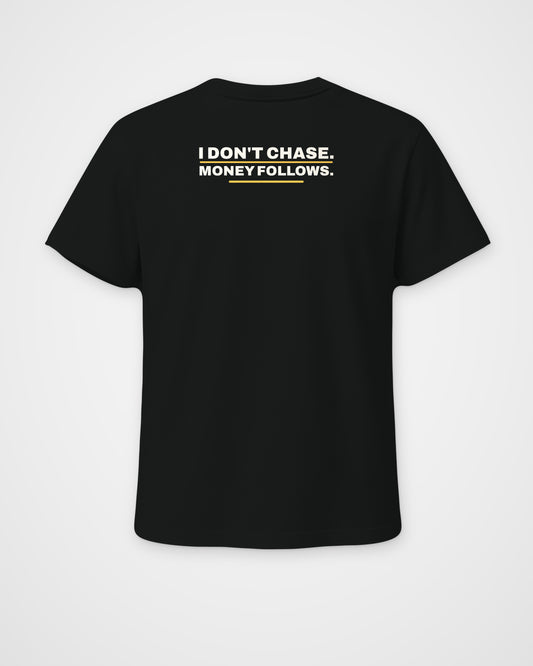 Black regular fit tee, back view, print reading I don't chase. Money follows – digital mockup