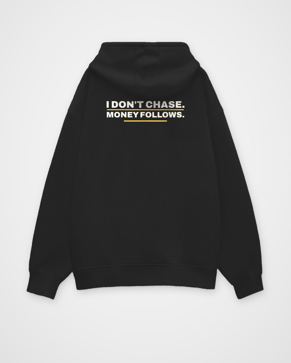 Black oversized hoodie, back view, print reading I don't chase. Money follows – digital mockup