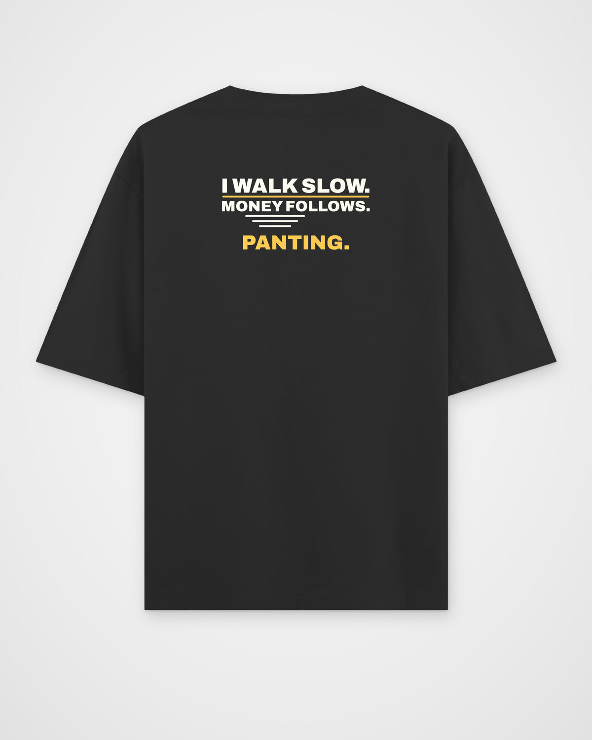 Black oversized tee, back view, print reading I walk slow. Money follows. Panting – digital mockup