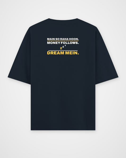 Navy Blue oversized tee, back view, print reading Main so raha hoon. Money follows. Dream mein – digital mockup