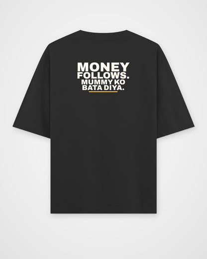 Black oversized tee, back view, print reading Money follows. Mummy ko bata diya – digital mockup