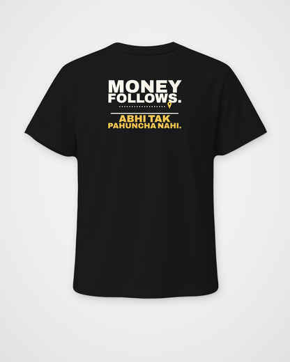 Black regular fit tee, back view, print reading Money follows. Abhi tak pahuncha nahi – digital mockup
