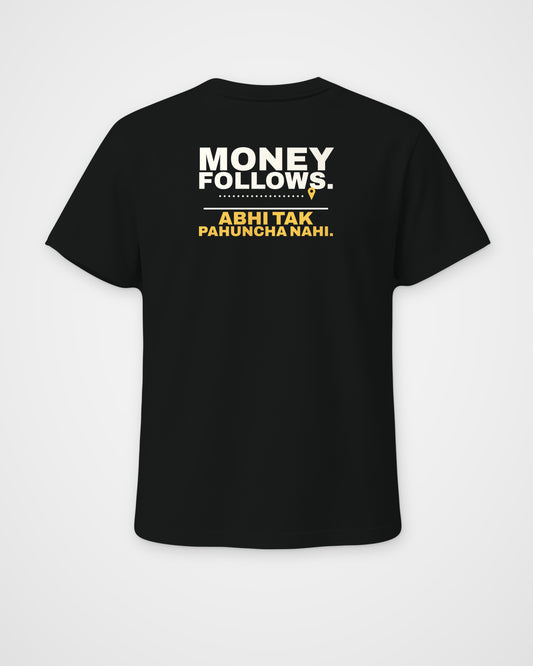 Black regular fit tee, back view, print reading Money follows. Abhi tak pahuncha nahi – digital mockup