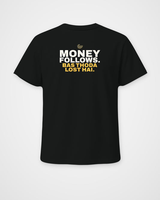 Black regular fit tee, back view, print reading Money follows. Bas thoda lost hai – digital mockup