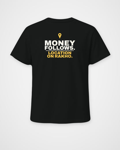 Black regular fit tee, back view, print reading Money follows. Location on rakho – digital mockup