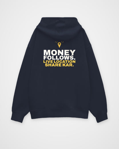 Navy Blue oversized hoodie, back view, print reading Money follows. Live location share kar – digital mockup