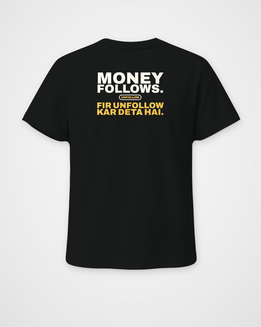 Black regular fit tee, back view, print reading Money follows. Fir unfollow kar deta hai – digital mockup