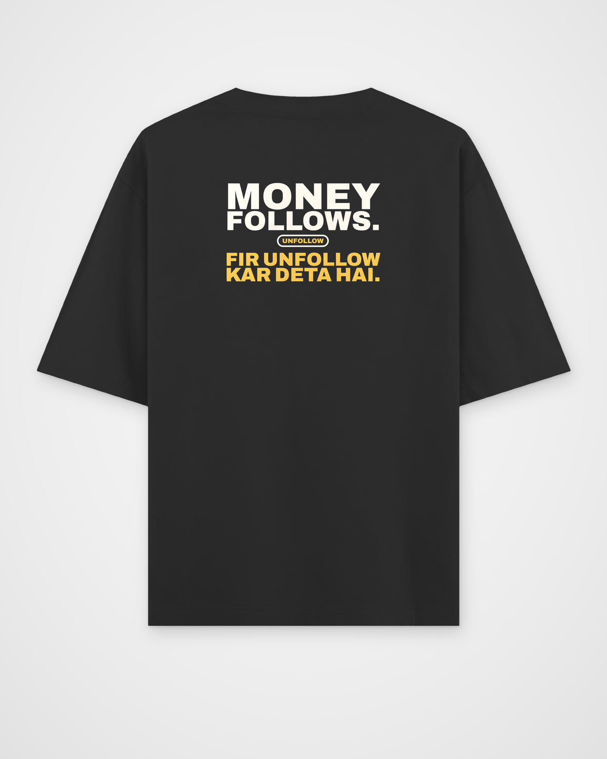Black oversized tee, back view, print reading Money follows. Fir unfollow kar deta hai – digital mockup