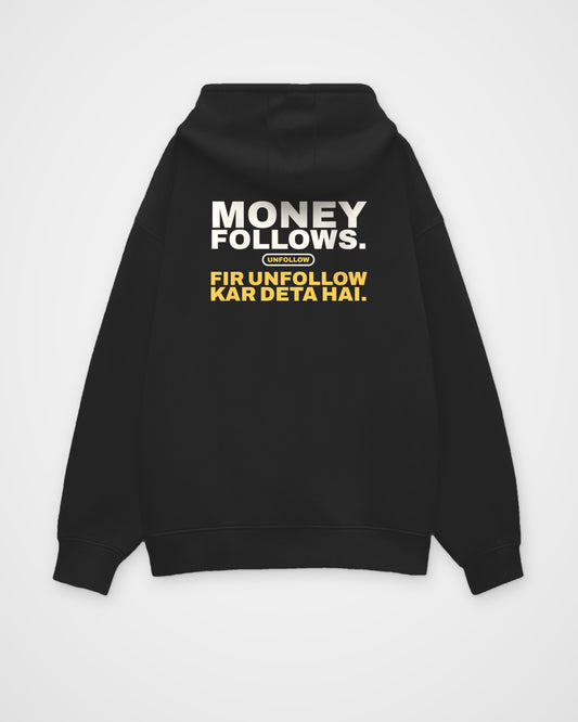 Black oversized hoodie, back view, print reading Money follows. Fir unfollow kar deta hai – digital mockup