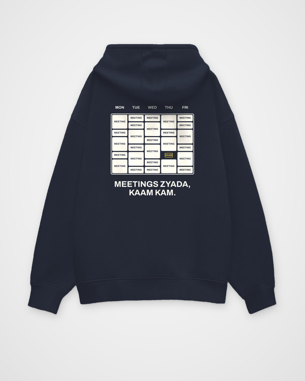 Navy blue oversized hoodie, back view, with a week calendar full of meetings and Meetings zyada, kaam kam