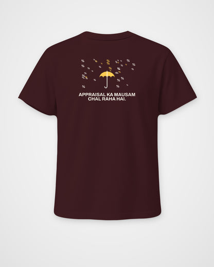 Maroon regular fit t-shirt, back view, with a small umbrella under a rain of percent signs and Appraisal ka – digital mockup