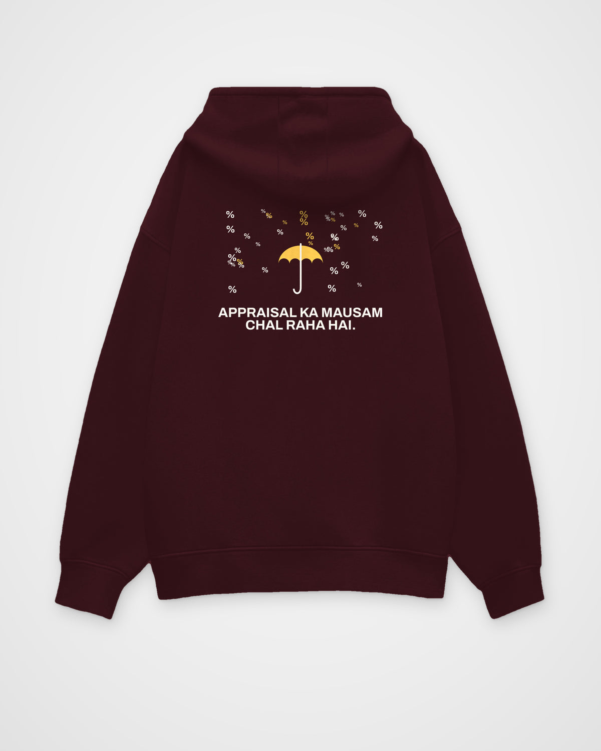Maroon oversized hoodie, back view, with a small umbrella under a rain of percent signs and Appraisal ka – digital mockup