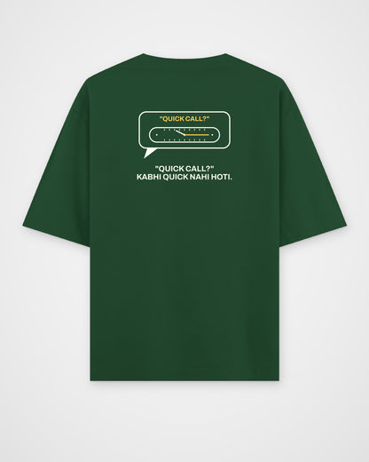 Bottle green oversized t-shirt, back view, with a QUICK CALL? speech bubble with a stretching clock and – digital mockup