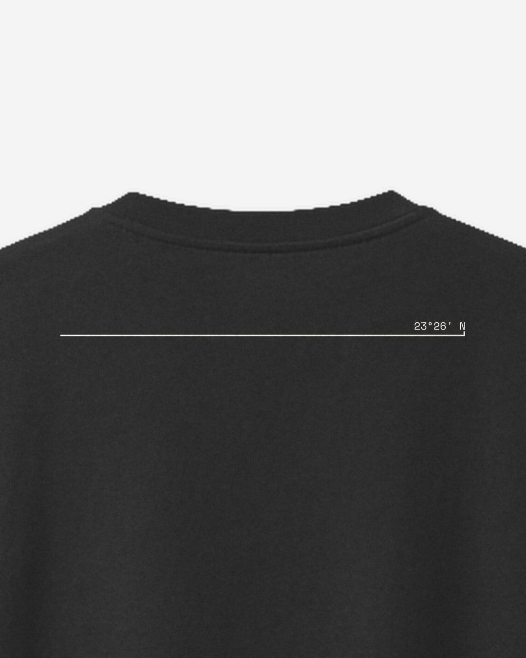 Black oversized t-shirt, close-up of the Kark Rekha print