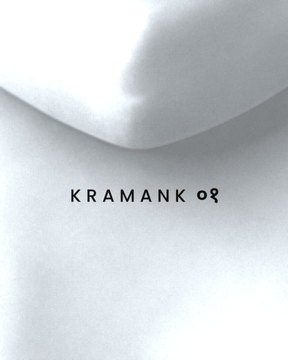 White oversized hoodie, close-up of the Kramank print
