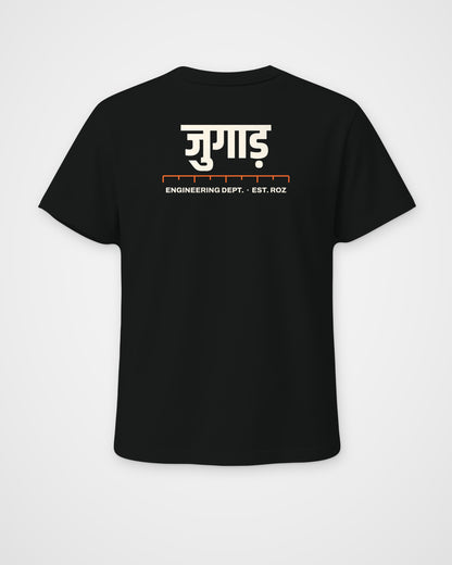 Black regular fit t-shirt, back view, a big Hindi wordmark reading jugaad, a ruler and ENGINEERING DEPT – digital mockup