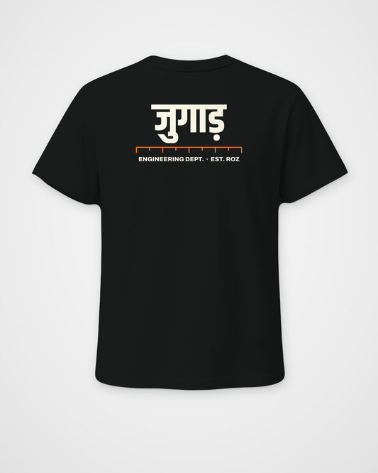 Black regular fit t-shirt, back view, a big Hindi wordmark reading jugaad, a ruler and ENGINEERING DEPT – digital mockup
