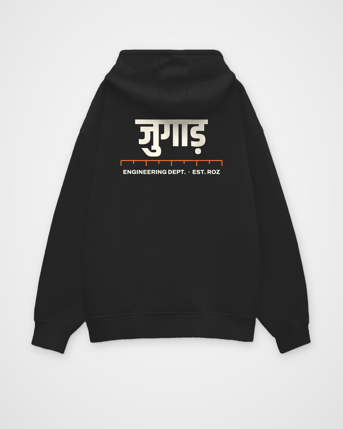 Black oversized hoodie, back view, a big Hindi wordmark reading jugaad, a ruler and ENGINEERING DEPT. EST – digital mockup