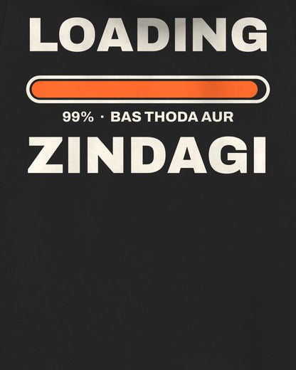 Black oversized hoodie, close-up of the Loading Zindagi 99% back print – digital mockup