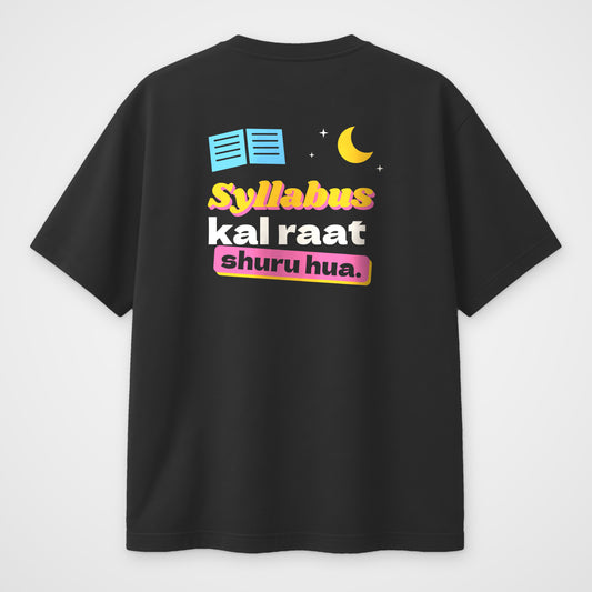 Black oversized t-shirt, back view, print reading Syllabus kal raat shuru hua with a moon and open book