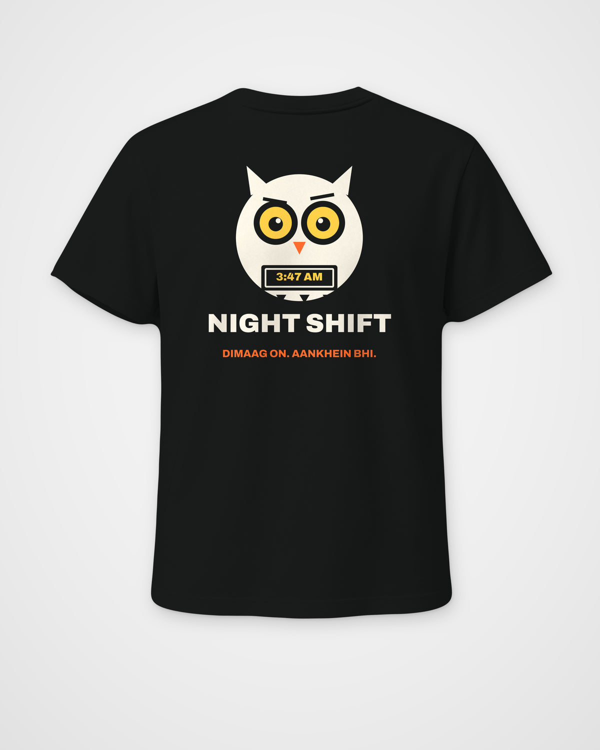 Black regular fit t-shirt, back view, a wide-awake owl holding a laptop at 3:47 AM, NIGHT SHIFT and DIMAAG – digital mockup