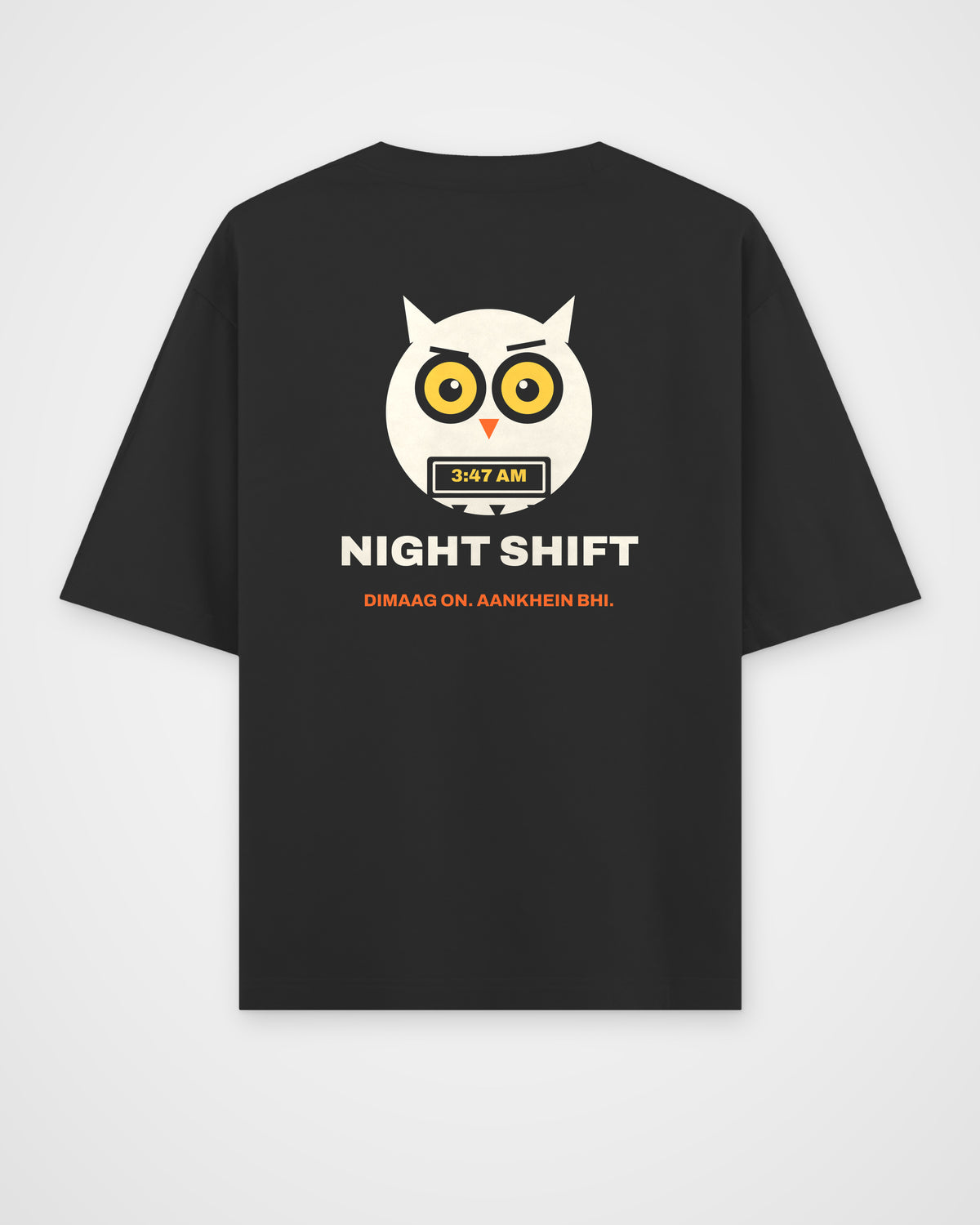 Black oversized t-shirt, back view, a wide-awake owl holding a laptop at 3:47 AM, NIGHT SHIFT and DIMAAG – digital mockup