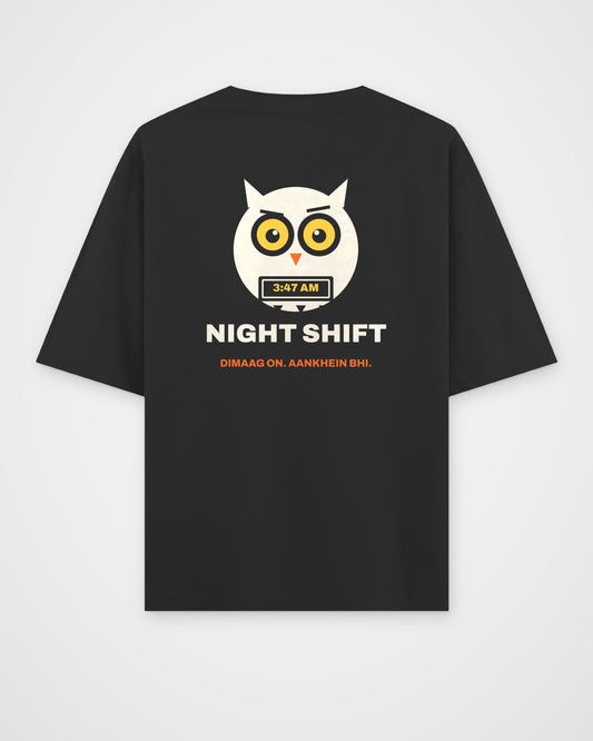 Black oversized t-shirt, back view, a wide-awake owl holding a laptop at 3:47 AM, NIGHT SHIFT and DIMAAG – digital mockup