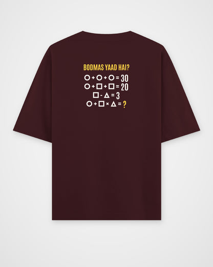 Maroon oversized t-shirt, back view with one large puzzle print