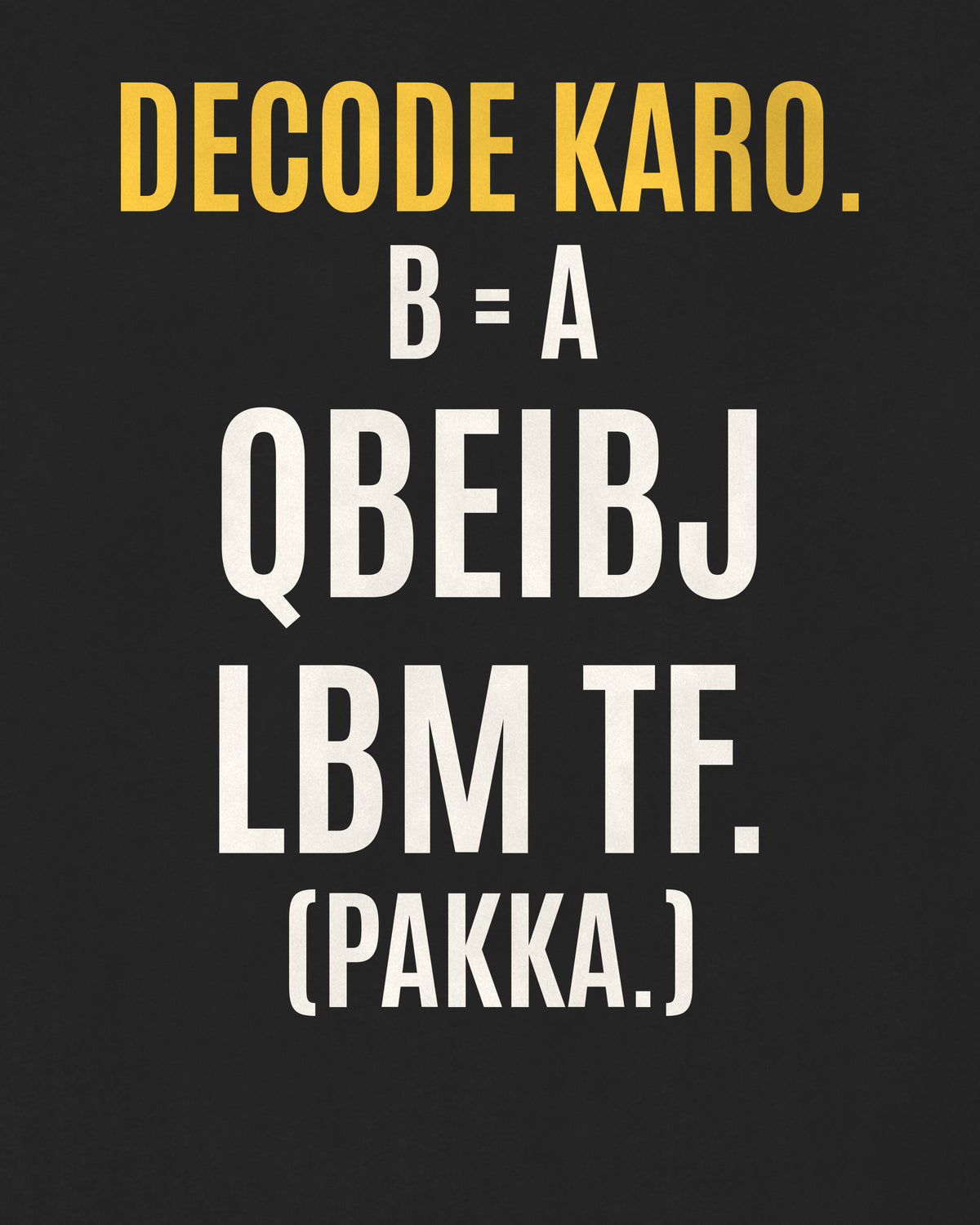 Black oversized hoodie, close-up of the back puzzle print: Decode karo. B = A: QBEIBJ LBM TF. (PAKKA.)