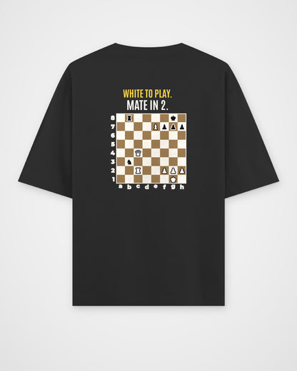 Black oversized t-shirt, back view with one large puzzle print
