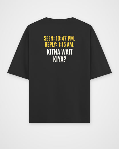 Black oversized t-shirt, back view with one large puzzle print