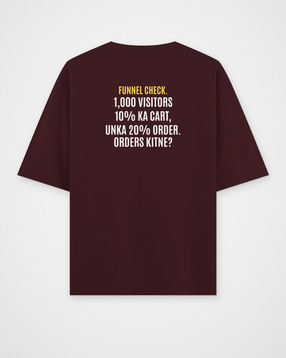 Maroon oversized t-shirt, back view with one large puzzle print
