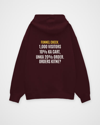 Maroon oversized hoodie, back view with one large puzzle print