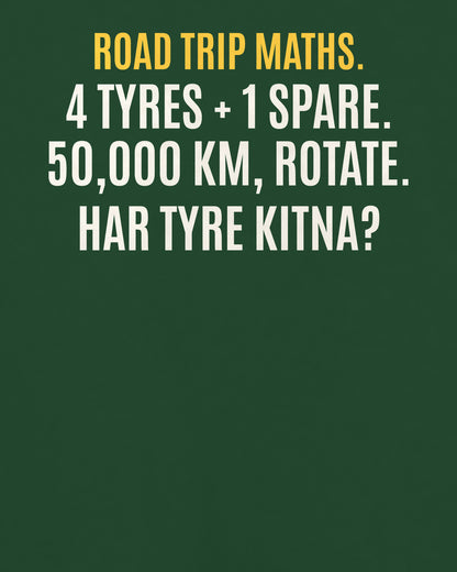 Bottle Green oversized t-shirt, close-up of the back puzzle print: 4 tyres + 1 spare, rotate karke 50,000 km. Sab barabar ghise. Har tyre kitna chala?