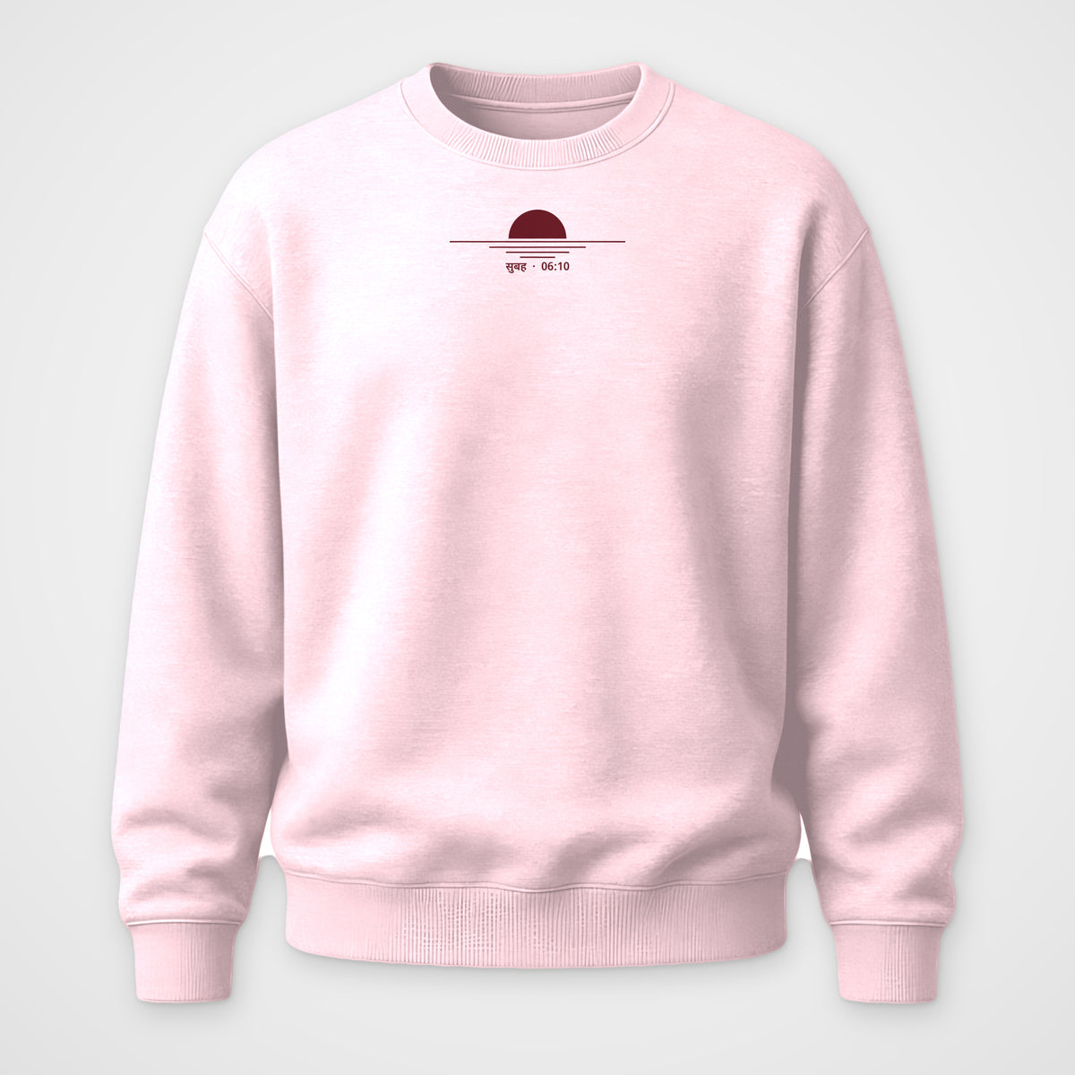 Light pink crewneck sweatshirt, front view, with maroon line art and the words सुबह 06:10 on the chest