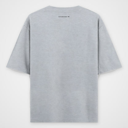 Grey melange oversized T-shirt, back view, thin text strip KRAMANK 01 just below the collar