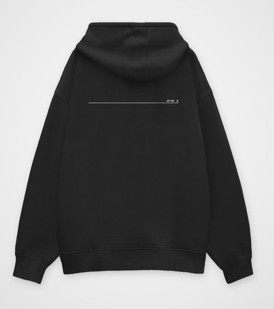 Black oversized hoodie, back view, one thin line across the upper back ending in 23°26′ N
