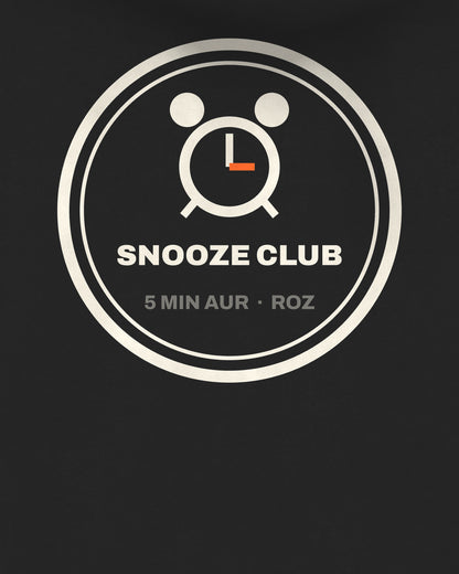 Black oversized hoodie, close-up of the Snooze Club Alarm back print – digital mockup