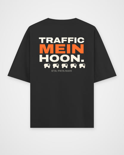 Black oversized t-shirt, back view, full-width stacked TRAFFIC MEIN HOON. type, a rickshaw icon row and – digital mockup