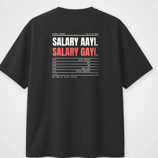 Black oversized t-shirt, back view, with a bank statement reading Salary aayi, Salary gayi