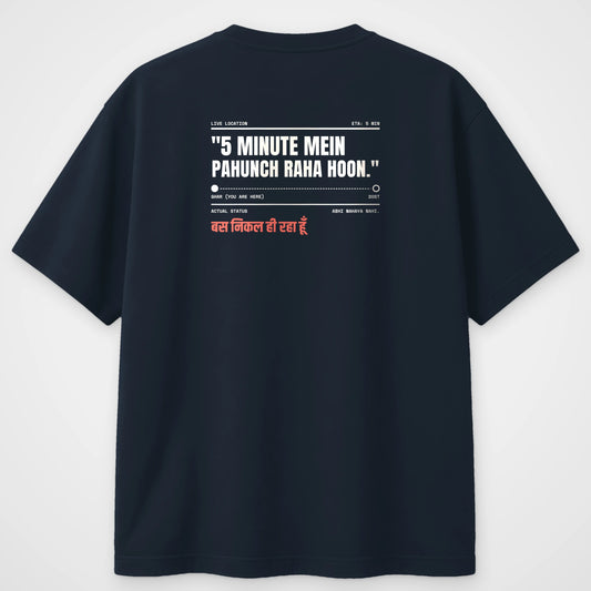 Navy blue oversized t-shirt, back view, with a live location tracker reading 5 minute mein pahunch raha hoon