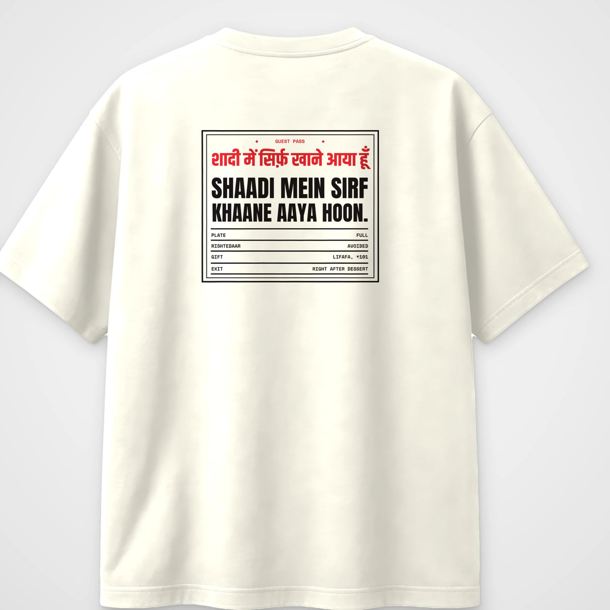 Off white oversized t-shirt, back view, with a wedding guest pass reading Shaadi mein sirf khaane aaya hoon